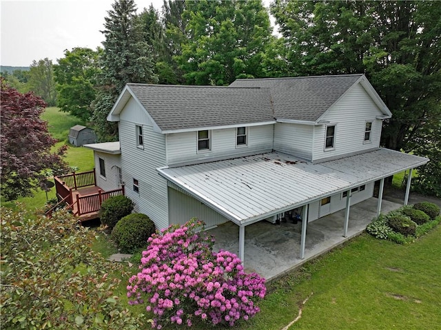 6956 E Washington St, Bath, NY 14810 - rear view of property with a yard, a deck, metal roof, and a shingled roof