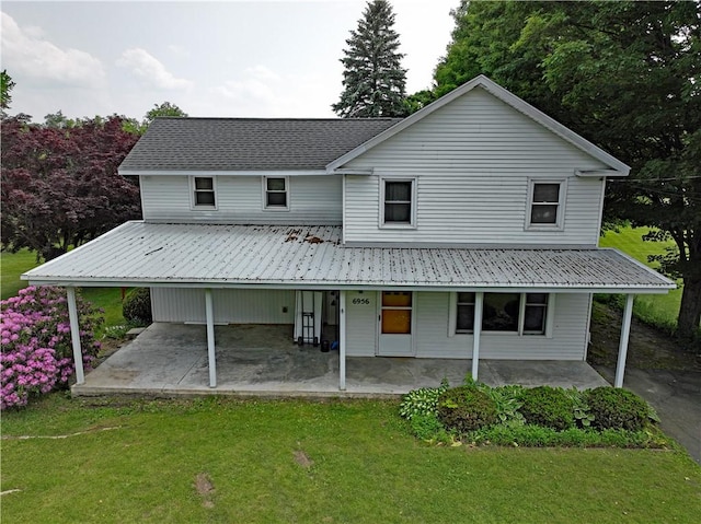 6956 E Washington St, Bath, NY 14810 - rear view of property featuring a lawn, metal roof, and covered porch