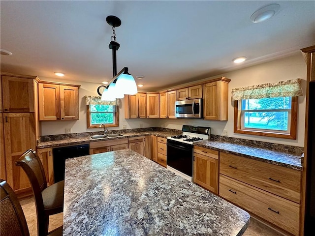 6956 E Washington St, Bath, NY 14810 - kitchen with stainless steel microwave, range with gas stovetop, a sink, a kitchen island, and dishwasher