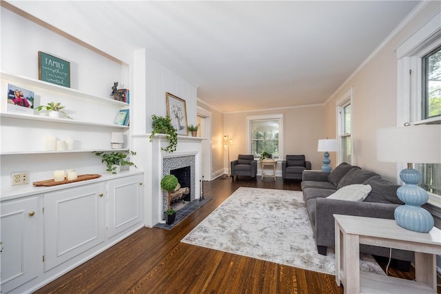 40 Washington Rd, Pittsford, NY 14534 - living room featuring a tiled fireplace, dark wood-type flooring, and ornamental molding