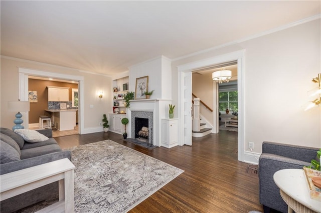 40 Washington Rd, Pittsford, NY 14534 - living room featuring dark wood-style floors, stairway, ornamental molding, a tiled fireplace, and baseboards