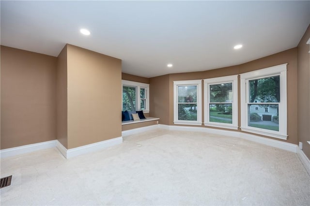 40 Washington Rd, Pittsford, NY 14534 - unfurnished living room featuring baseboards, carpet flooring, and recessed lighting