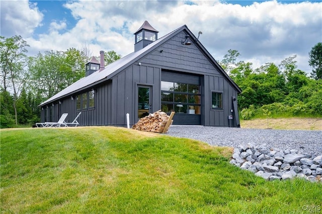 4500 W Lake Rd, Niles, NY 13152 - view of property exterior featuring board and batten siding, a yard, and a chimney