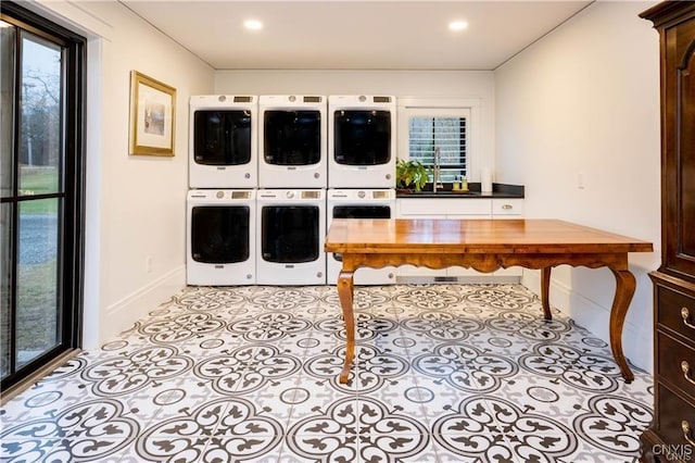 4500 W Lake Rd, Niles, NY 13152 - laundry room featuring stacked washer / dryer, baseboards, plenty of natural light, an office area, and recessed lighting