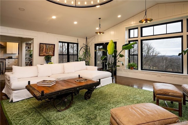 4500 W Lake Rd, Niles, NY 13152 - living room with lofted ceiling, wood finished floors, recessed lighting, and a decorative wall