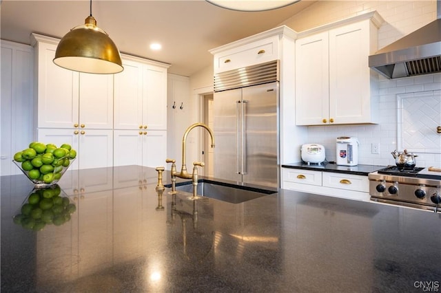 4500 W Lake Rd, Niles, NY 13152 - kitchen featuring wall chimney range hood, high quality appliances, a sink, and white cabinets