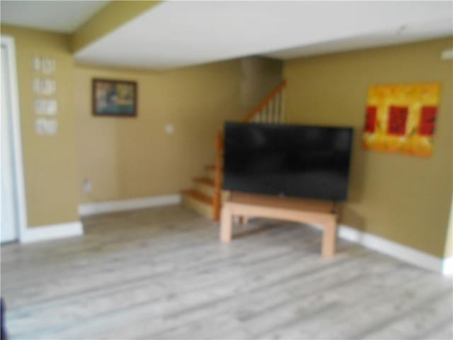 4700 W Lake Rd, Fleming, NY 13021 - living area featuring stairway and baseboards