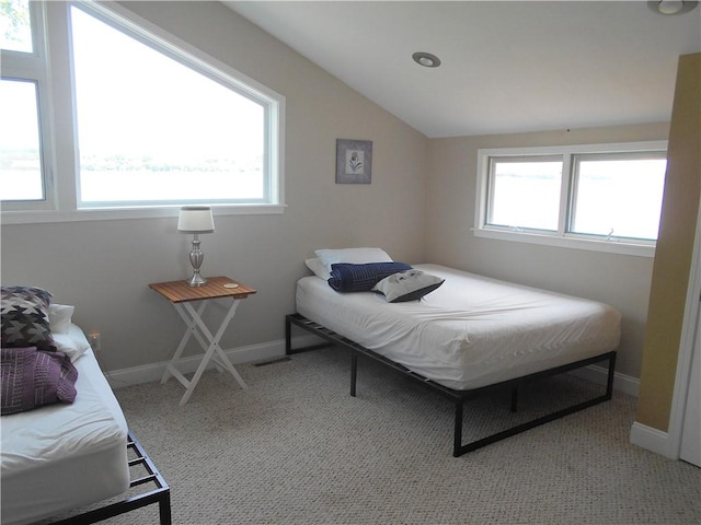 4700 W Lake Rd, Fleming, NY 13021 - bedroom featuring vaulted ceiling, light carpet, and baseboards