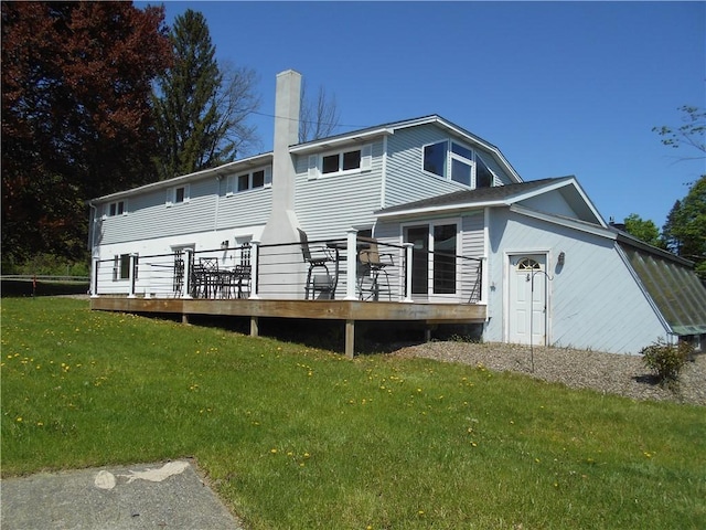 4700 W Lake Rd, Fleming, NY 13021 - back of property with a wooden deck, a chimney, and a lawn