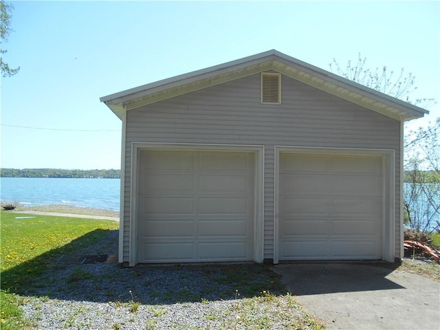4700 W Lake Rd, Fleming, NY 13021 - detached garage featuring a water view