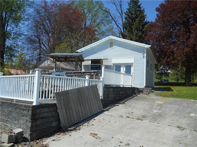 4700 W Lake Rd, Fleming, NY 13021 - view of side of property with a deck
