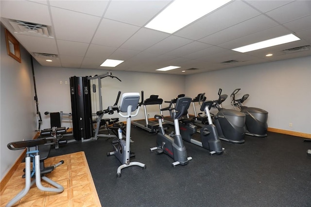 135 Cliffside Dr, South Bristol, NY 14424 - gym featuring baseboards and a paneled ceiling