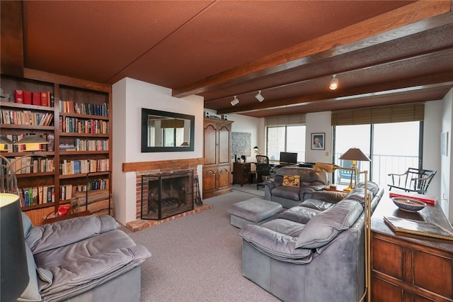 135 Cliffside Dr, South Bristol, NY 14424 - living area with carpet, a fireplace, and beamed ceiling