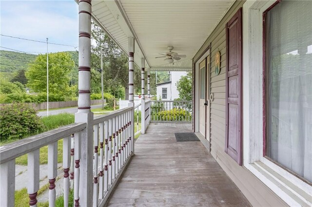 39 Middle St, Hancock, NY 13756 - wooden porch featuring a ceiling fan