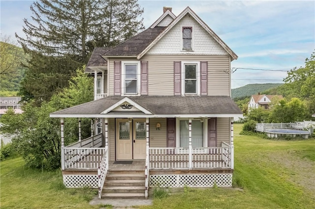 39 Middle St, Hancock, NY 13756 - view of front of home with a porch, a front lawn, and roof with shingles