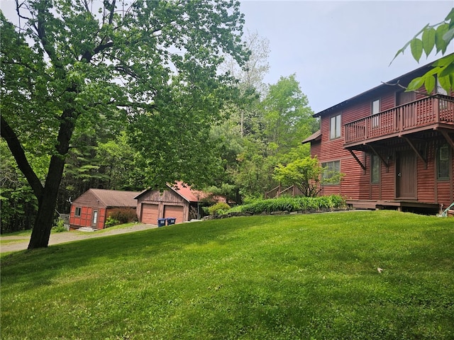 139 Pheasant Run Rd, Middlefield, NY 13326 - view of green lawn featuring a detached garage