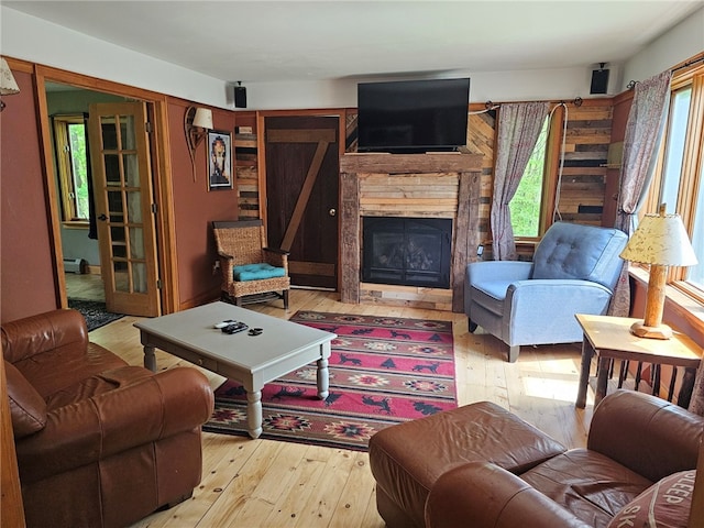 139 Pheasant Run Rd, Middlefield, NY 13326 - living room with wood-type flooring and a stone fireplace