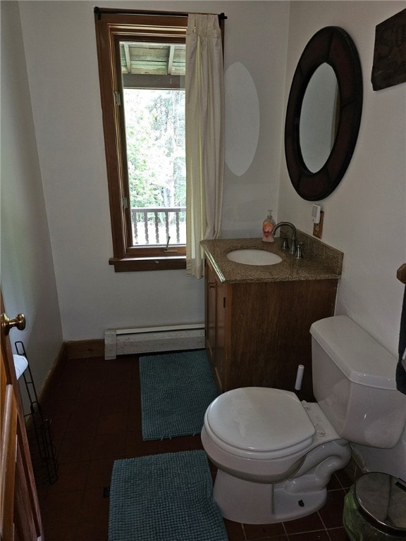 139 Pheasant Run Rd, Middlefield, NY 13326 - bathroom with a baseboard radiator, toilet, vanity, tile patterned flooring, and baseboards
