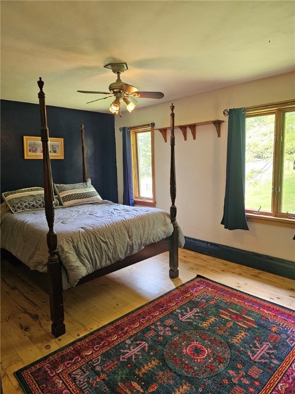 139 Pheasant Run Rd, Middlefield, NY 13326 - bedroom featuring hardwood / wood-style floors, multiple windows, and baseboards