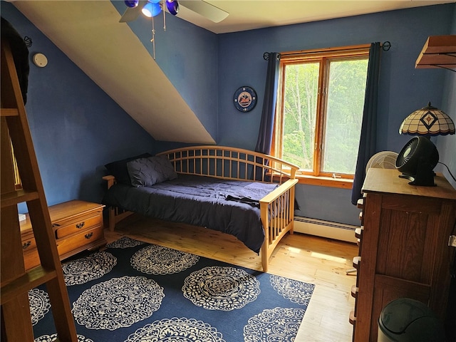 139 Pheasant Run Rd, Middlefield, NY 13326 - bedroom with baseboard heating, wood finished floors, and ceiling fan