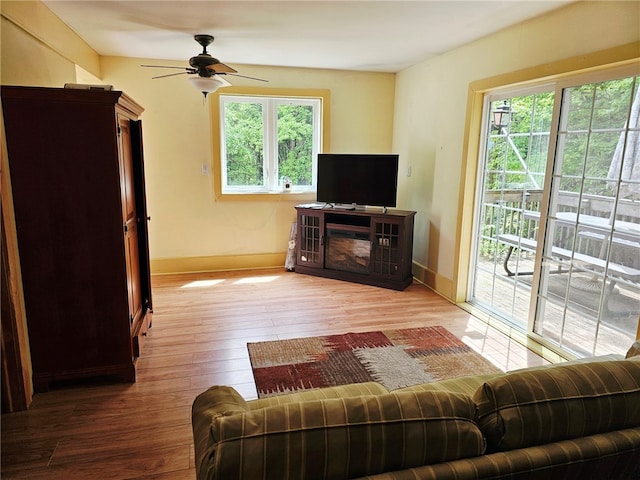139 Pheasant Run Rd, Middlefield, NY 13326 - living room featuring a ceiling fan, wood finished floors, and baseboards