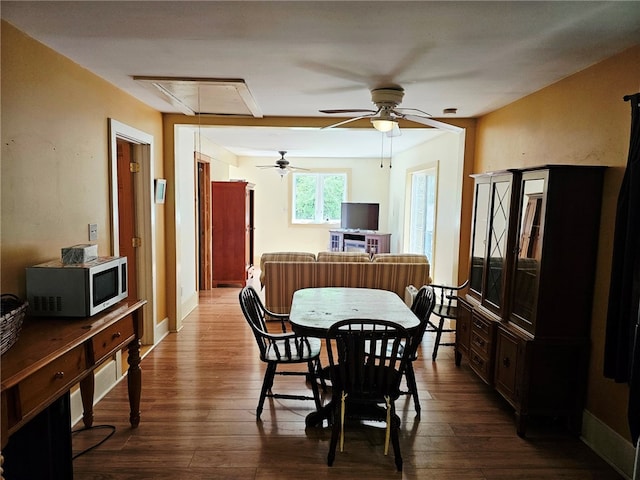 139 Pheasant Run Rd, Middlefield, NY 13326 - dining room with attic access, dark wood-style floors, and a ceiling fan