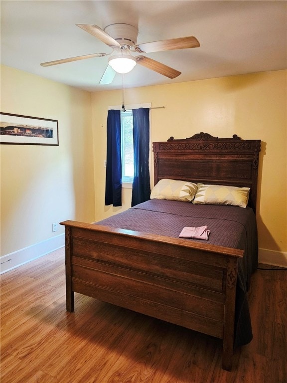 139 Pheasant Run Rd, Middlefield, NY 13326 - bedroom featuring baseboards, wood finished floors, and a ceiling fan