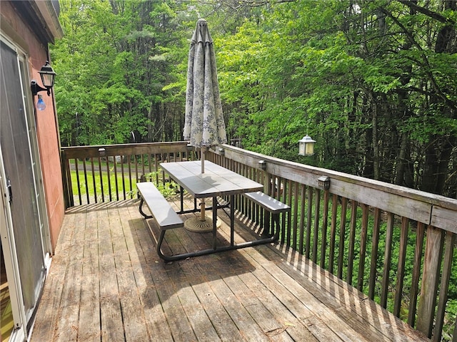 139 Pheasant Run Rd, Middlefield, NY 13326 - deck with outdoor dining area and a view of trees
