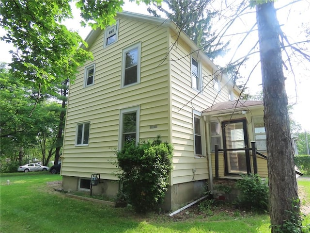 6018 Dunning Ave, Fleming, NY 13021 - view of side of property with a yard and a sunroom