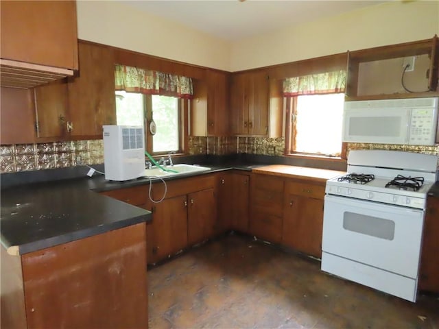 6018 Dunning Ave, Fleming, NY 13021 - kitchen featuring white appliances, a sink, brown cabinets, and decorative backsplash