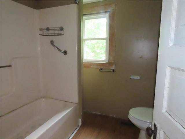 6018 Dunning Ave, Fleming, NY 13021 - bathroom featuring toilet, wood finished floors, and shower / tub combination