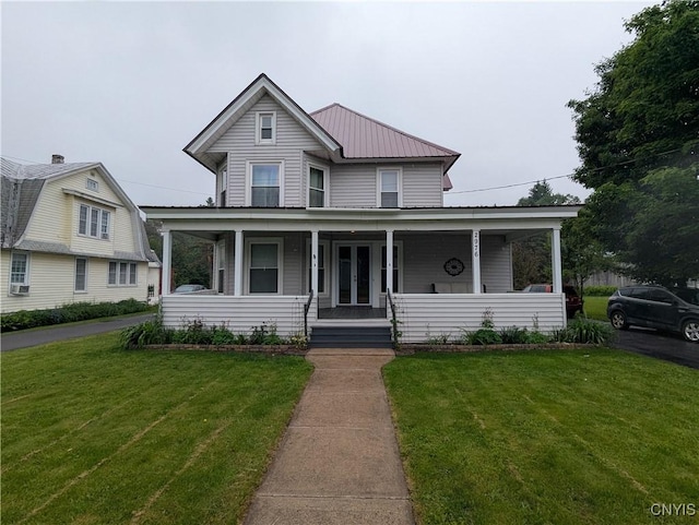 2976 Cataract St, Denmark, NY 13626 - view of front of property featuring covered porch, a front lawn, metal roof, and french doors