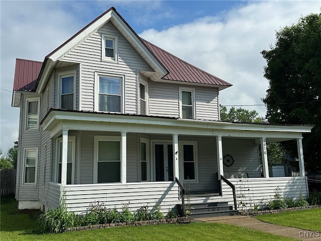 2976 Cataract St, Denmark, NY 13626 - view of front of property with metal roof and a porch