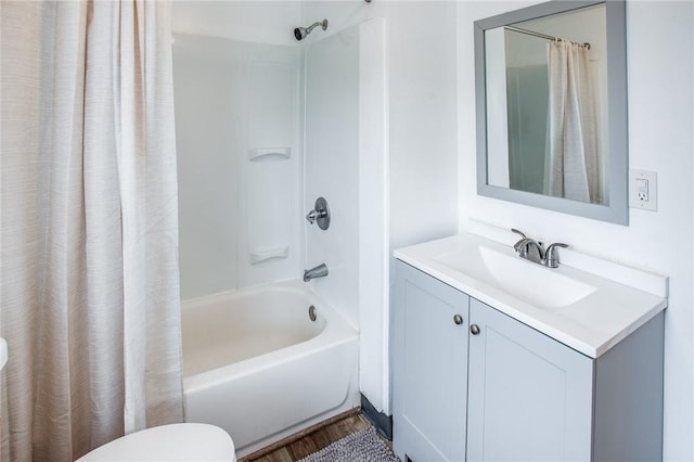 239 Weyl, Rochester, NY 14621 - bathroom featuring shower / tub combo, vanity, toilet, and wood finished floors