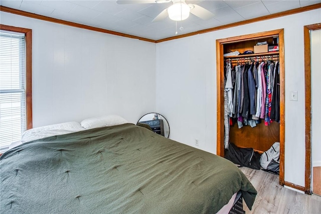 239 Weyl, Rochester, NY 14621 - bedroom with wood finished floors, crown molding, a closet, baseboards, and ceiling fan
