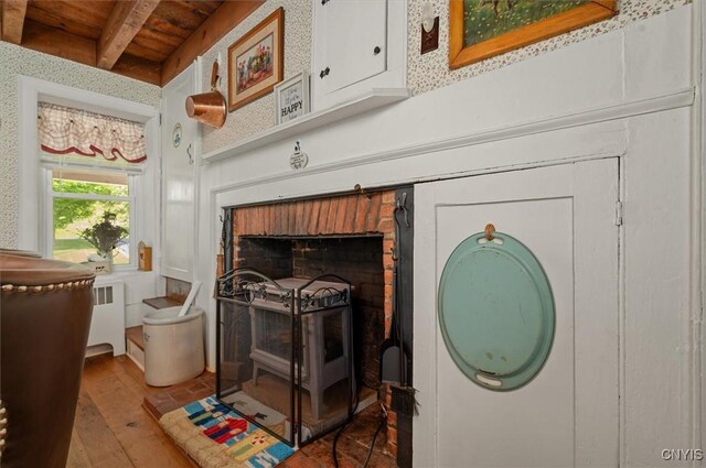 8796 State Highway 12, Sherburne, NY 13460 - detailed view of radiator, wood finished floors, and wood ceiling with exposed beams