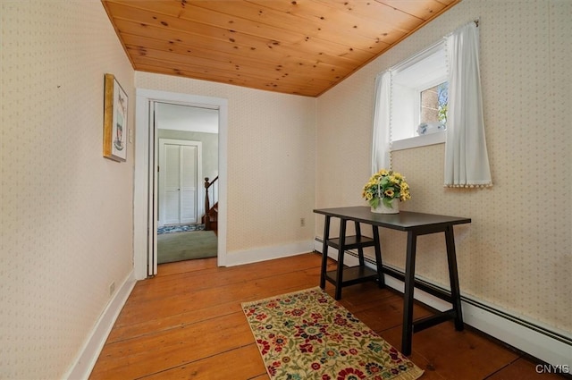 8796 State Highway 12, Sherburne, NY 13460 - corridor featuring wood-type flooring, wooden ceiling, a baseboard radiator, and stairs