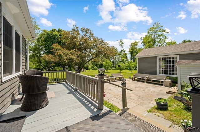 8796 State Highway 12, Sherburne, NY 13460 - wooden terrace featuring a patio and a yard