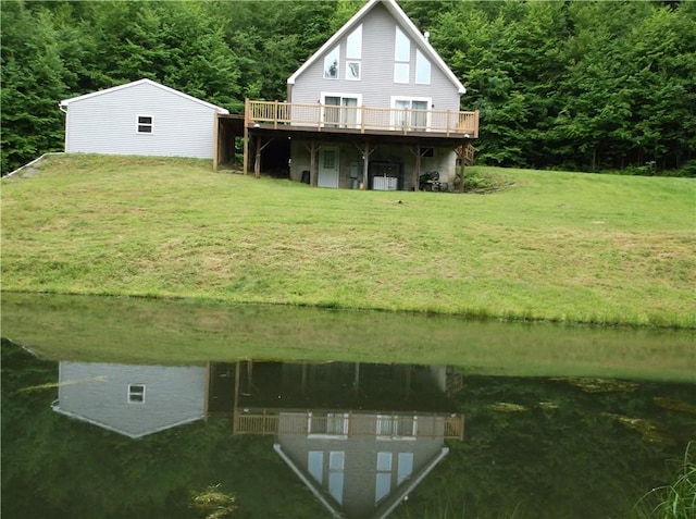 24780 State Highway 206, Colchester, NY 13755 - back of property with a deck with water view, a lawn, and a wooded view