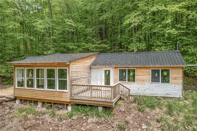 2712 Silver Lake Rd, Hancock, NY 13783 - view of front of property featuring metal roof, a wooden deck, and a wooded view
