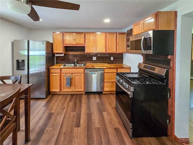 3636 Kennedy Rd, Lafayette, NY 13084 - kitchen with stainless steel appliances, a sink, dark wood-type flooring, a ceiling fan, and recessed lighting