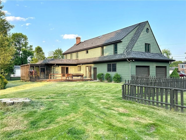 966 W Church St, Elmira, NY 14905 - rear view of property featuring a chimney, a garage, and a wooden deck