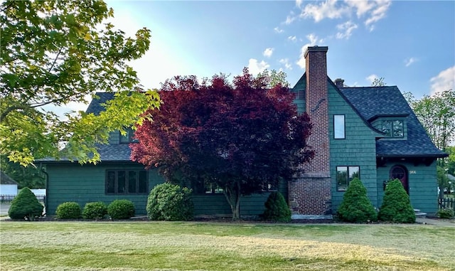 966 W Church St, Elmira, NY 14905 - view of home's exterior with a lawn, a chimney, and roof with shingles