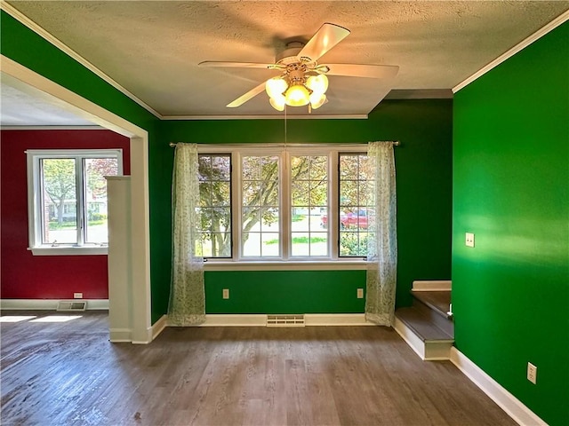 966 W Church St, Elmira, NY 14905 - spare room with crown molding, plenty of natural light, ceiling fan, a textured ceiling, and wood finished floors