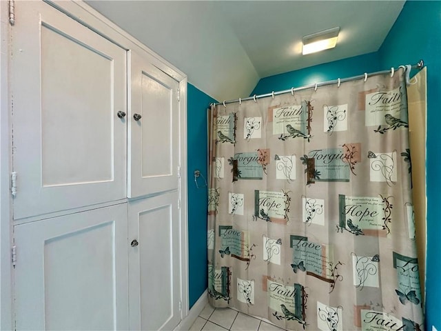 966 W Church St, Elmira, NY 14905 - full bath with lofted ceiling, tile patterned flooring, and a shower with curtain