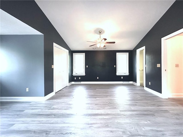 966 W Church St, Elmira, NY 14905 - empty room with vaulted ceiling, a ceiling fan, wood finished floors, and baseboards