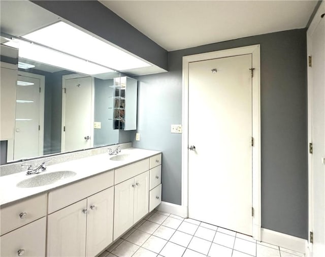 966 W Church St, Elmira, NY 14905 - full bathroom with double vanity, baseboards, and tile patterned floors