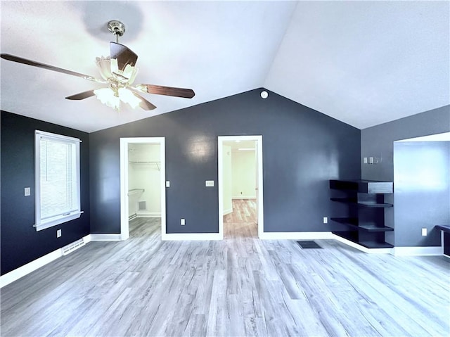 966 W Church St, Elmira, NY 14905 - unfurnished living room featuring a ceiling fan, vaulted ceiling, wood finished floors, and baseboards