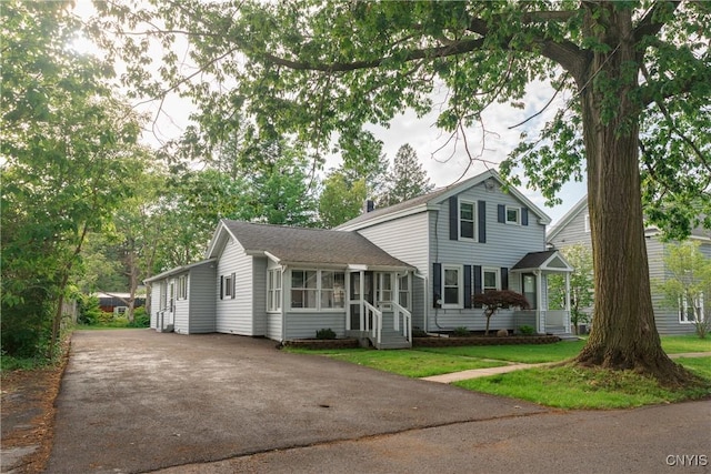 4 Division St, Van Buren, NY 13027 - view of front of house with a sunroom and driveway
