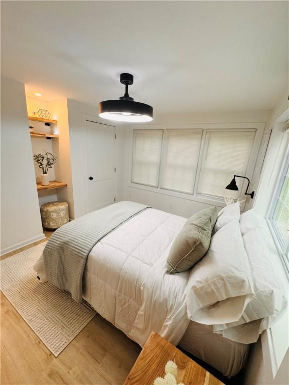 11 Laureldale Dr, Pittsford, NY 14534 - bedroom featuring wood finished floors and ceiling fan